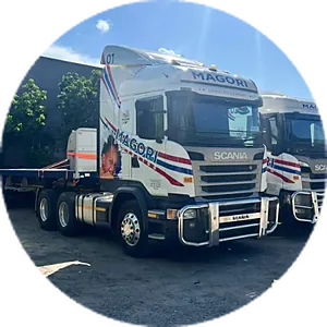 A Magori tractor unit coupled to its flatbed trailer